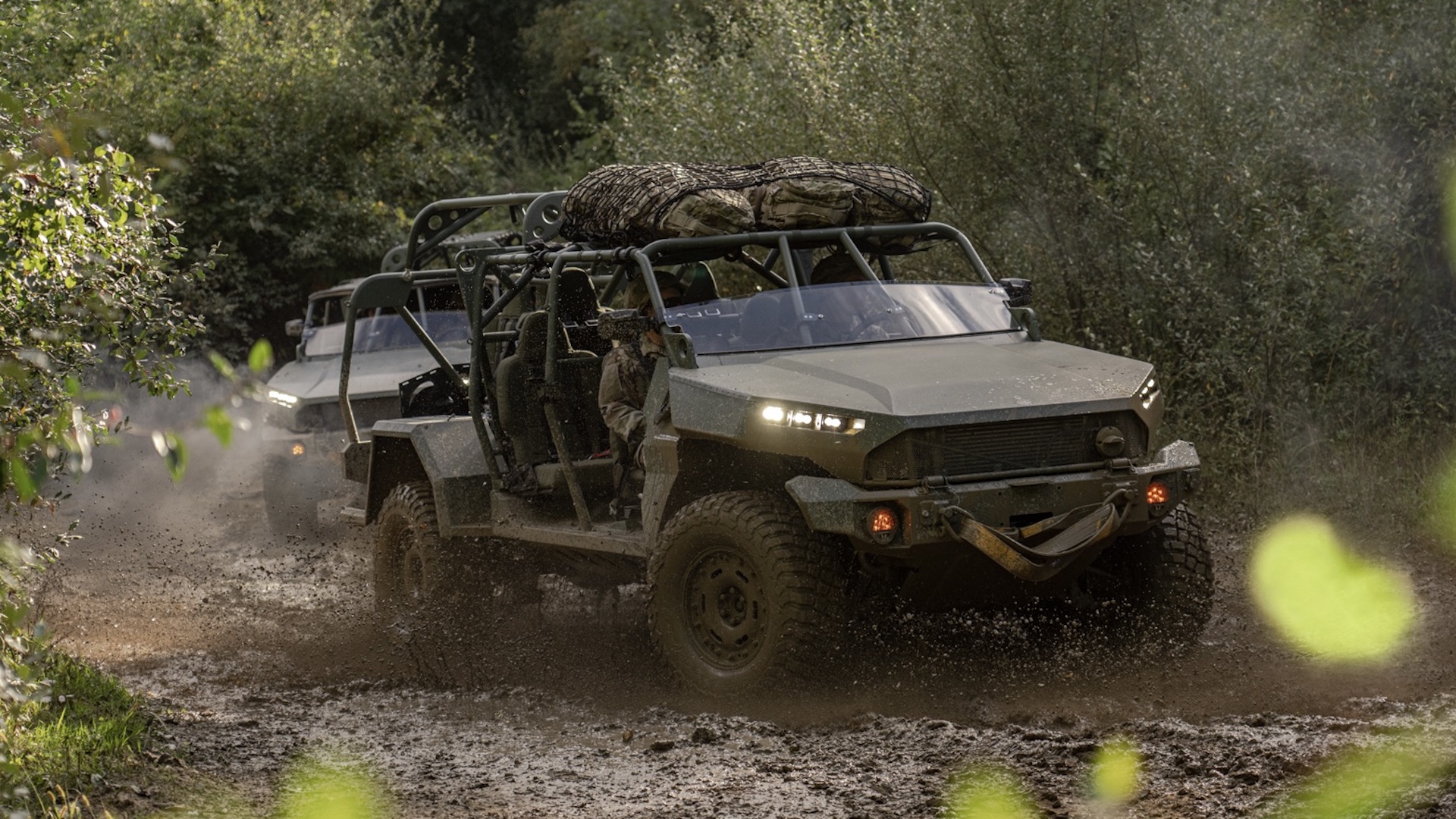 The Infantry Squad Vehicle demonstrates its rugged off-road capabilities through the mud.