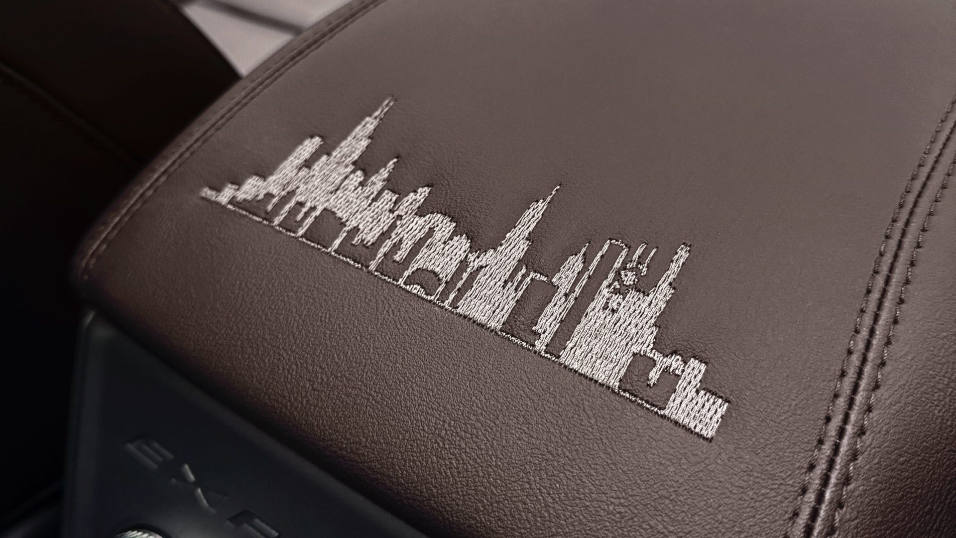 The city skyline is stitched into the center console.