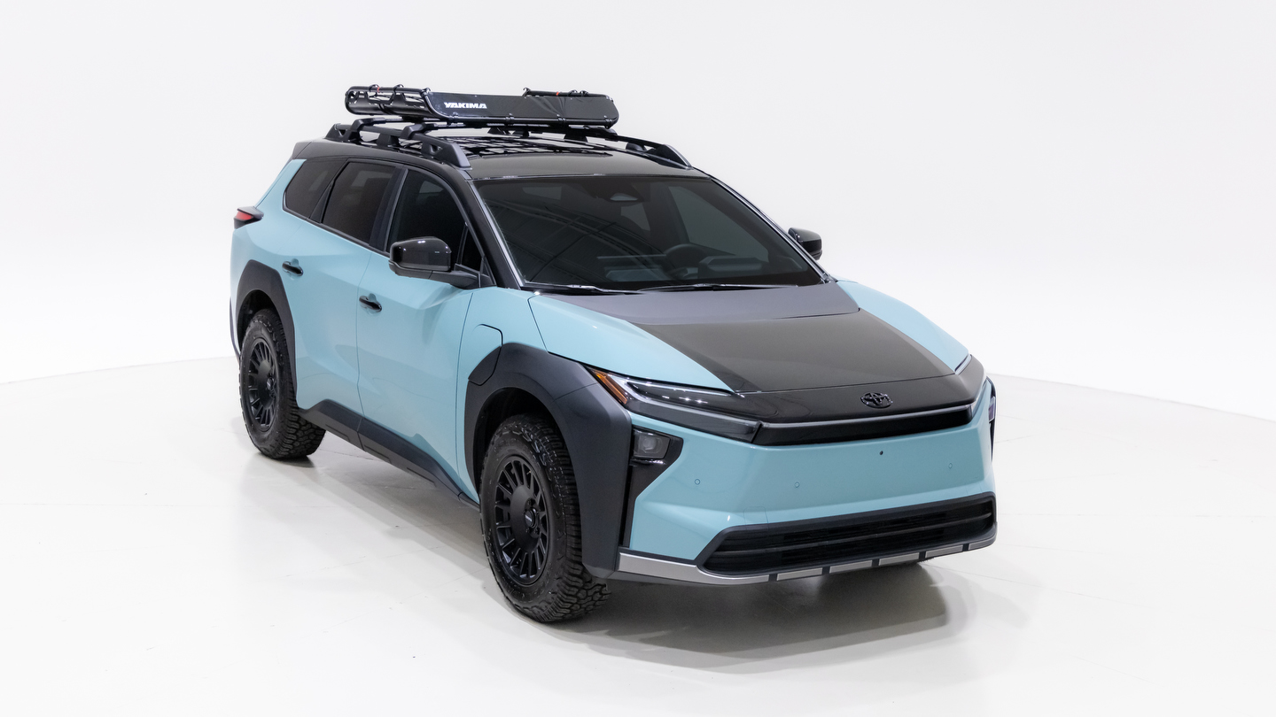 Elevated front three-quarter view of the Toyota bZ Woodland Concept showing its black hood and roof basket
